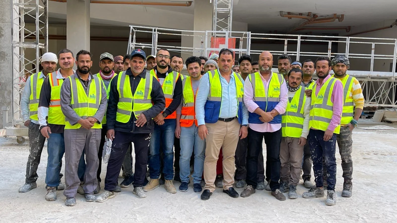 Construction workers reviewing plans